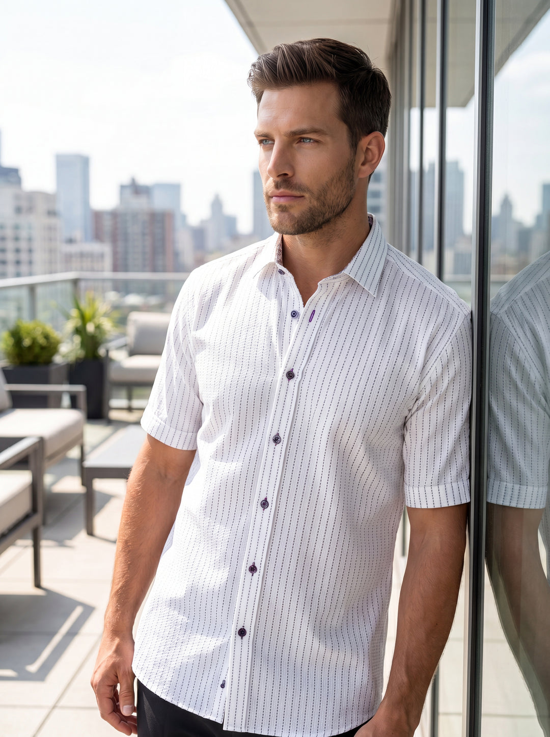This men's short-sleeve button-down shirt features a crisp white textured fabric with a subtle vertical pinstripe pattern. It includes unique decorative buttons with purple contrast stitching and a pointed collar, offering a refined take on classic warm-w
