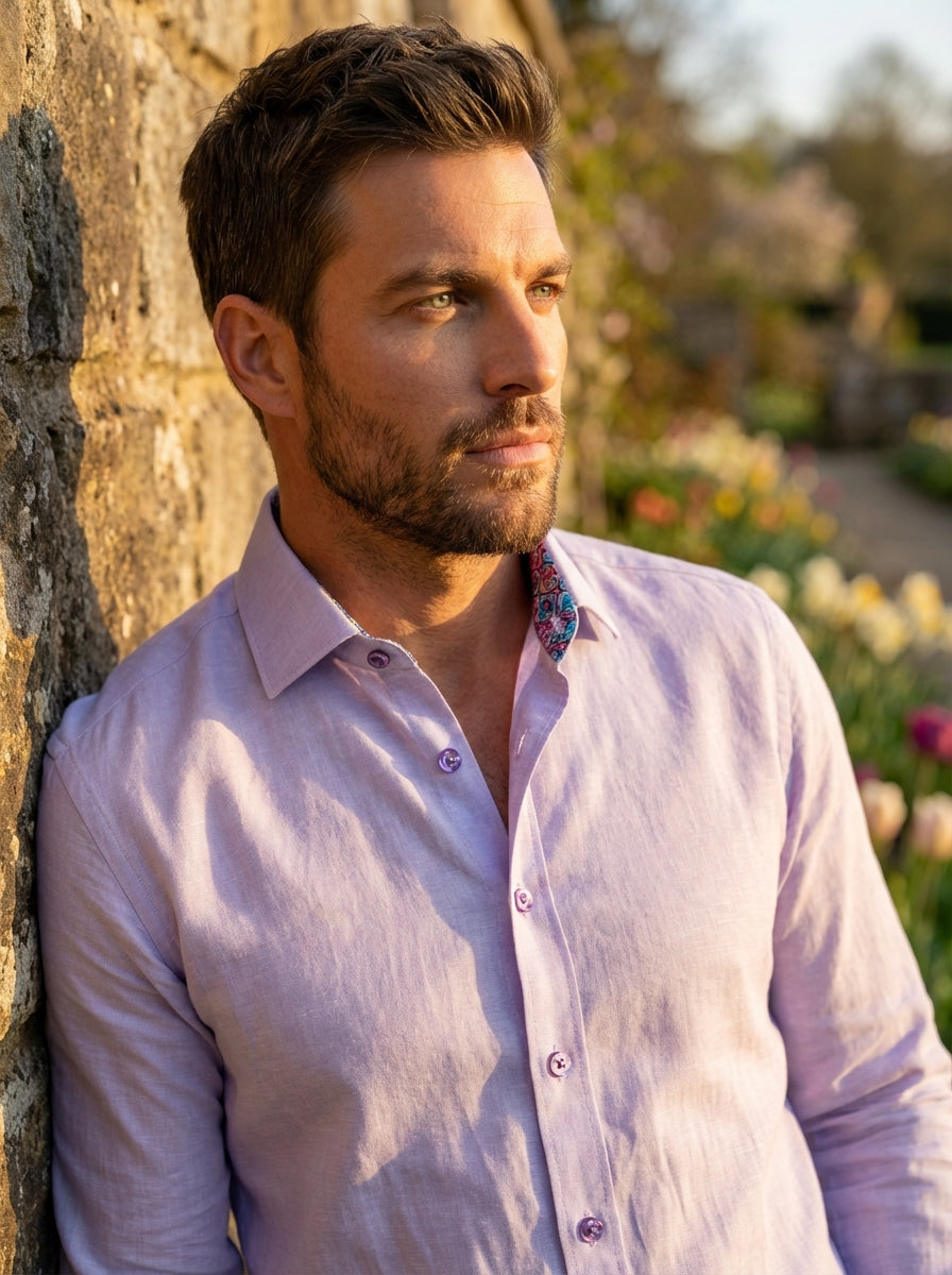 This Masutto long-sleeve dress shirt features a soft lavender hue in a textured linen-blend fabric. It is detailed with unique purple iridescent buttons and a vibrant, multicolored floral patterned trim inside the collar for a modern and sophisticated fin