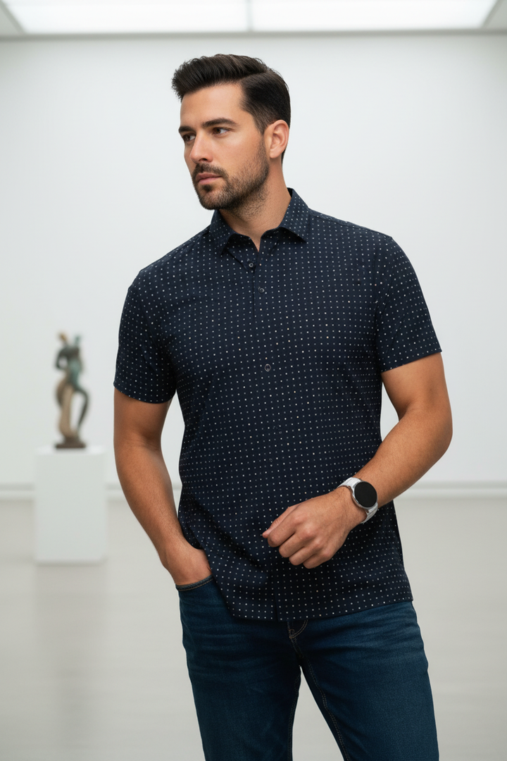 Elevate your smart-casual look with this sophisticated navy polo. Adorned with a distinctive multi-colored square dot pattern, it offers a refined yet playful aesthetic, perfect for the modern gentleman seeking comfort and unique style.