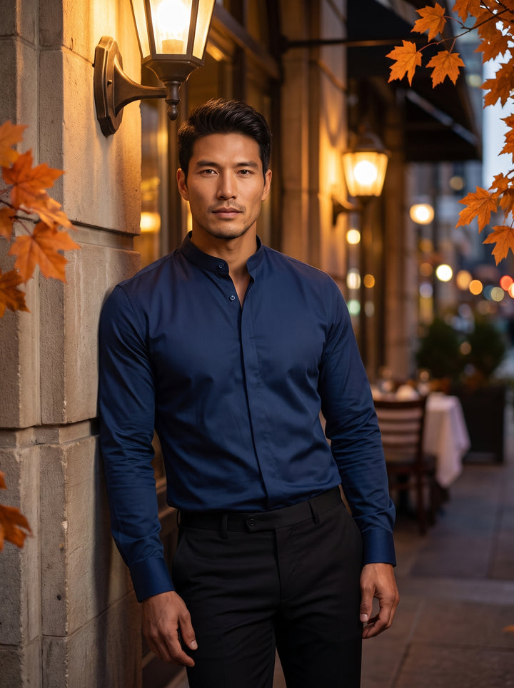A deep navy blue Masutto dress shirt featuring a sophisticated mandarin collar and a clean, hidden button placket. The smooth, slightly lustrous fabric and matching dark buttons on the cuffs create a modern, sleek aesthetic for formal or evening wear.