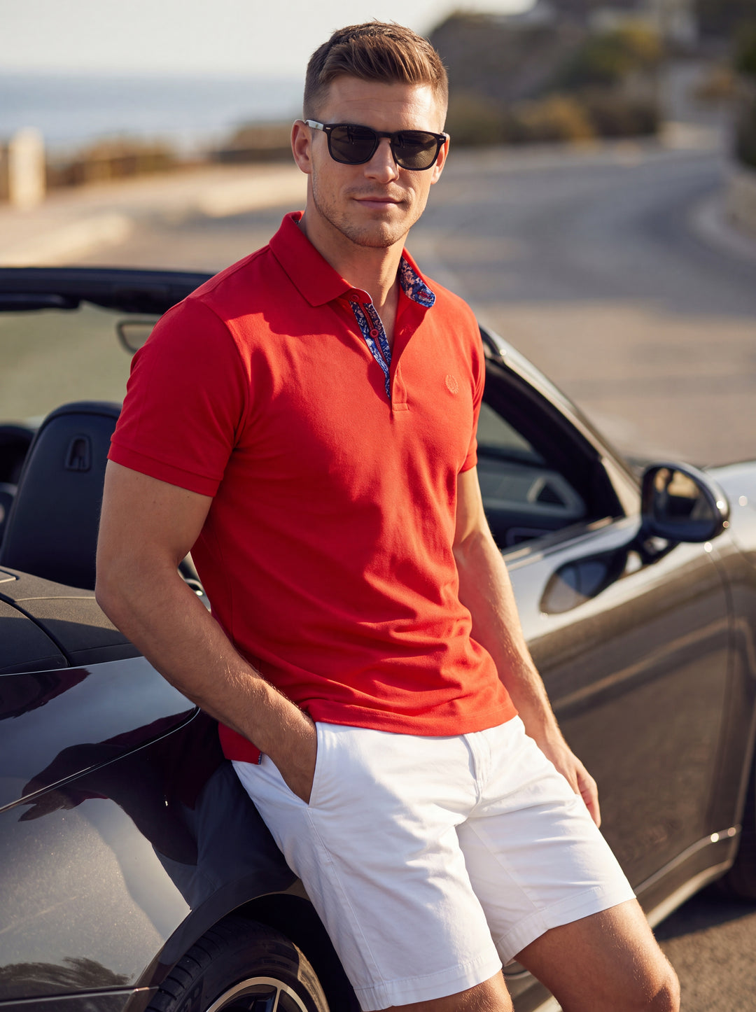 This vibrant red polo shirt features a classic three-button placket accented with a unique patterned inner lining. Crafted with short sleeves and a structured collar, the shirt offers a tailored fit that blends casual comfort with sophisticated, modern st