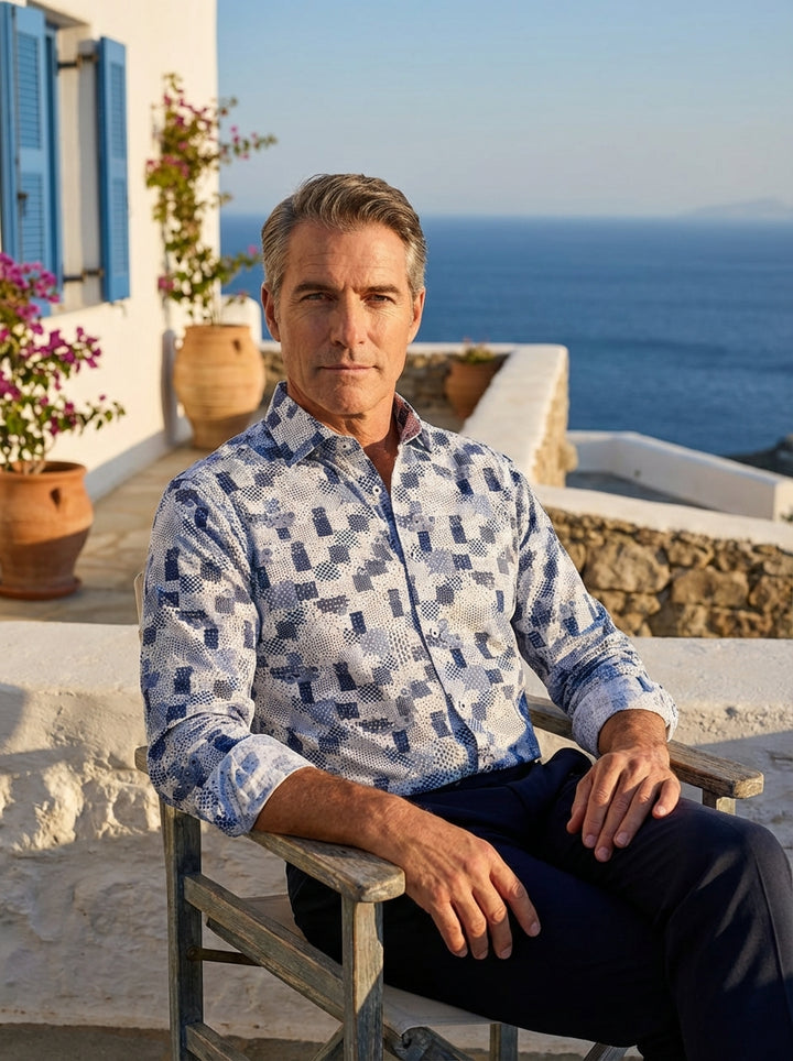 This Masutto men's button-down shirt features a sophisticated blue and white patchwork mosaic print. The intricate geometric patterns offer a modern twist on classic shirting, crafted with a structured collar and premium cotton for a crisp, stylish, and c