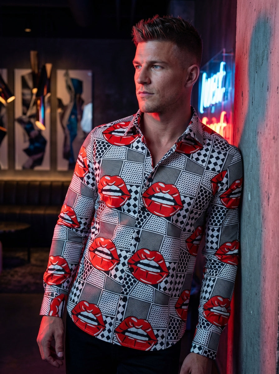 This bold, avant-garde button-down shirt features a graphic pop-art print with vibrant red lips against a black-and-white geometric comic book background. Crafted with a tailored fit and structured collar, it is a statement piece designed for those who em
