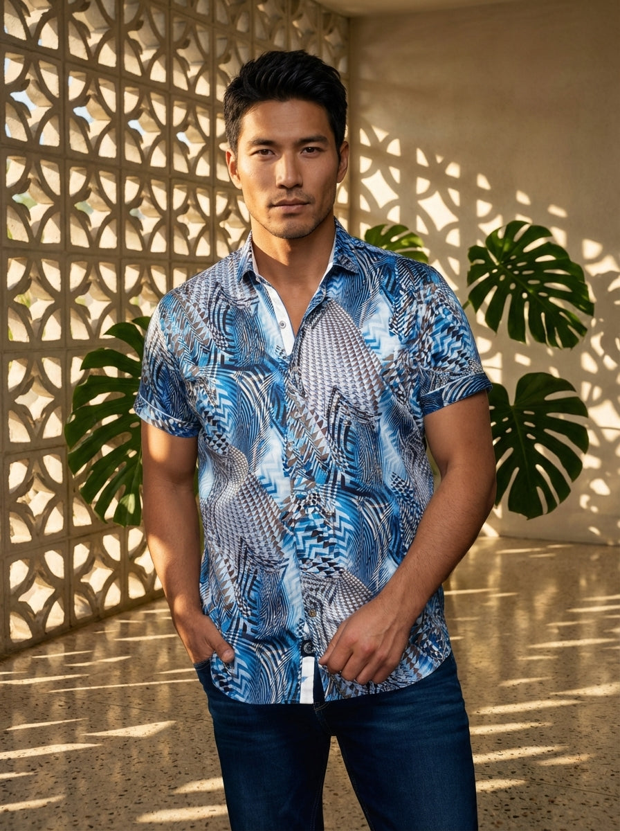 This men's short-sleeved button-down shirt features a dynamic blue and brown geometric abstract print. Crafted for a modern fit, it includes a sophisticated spread collar with contrast white inner placket detailing and buttoned sleeve cuffs for a polished