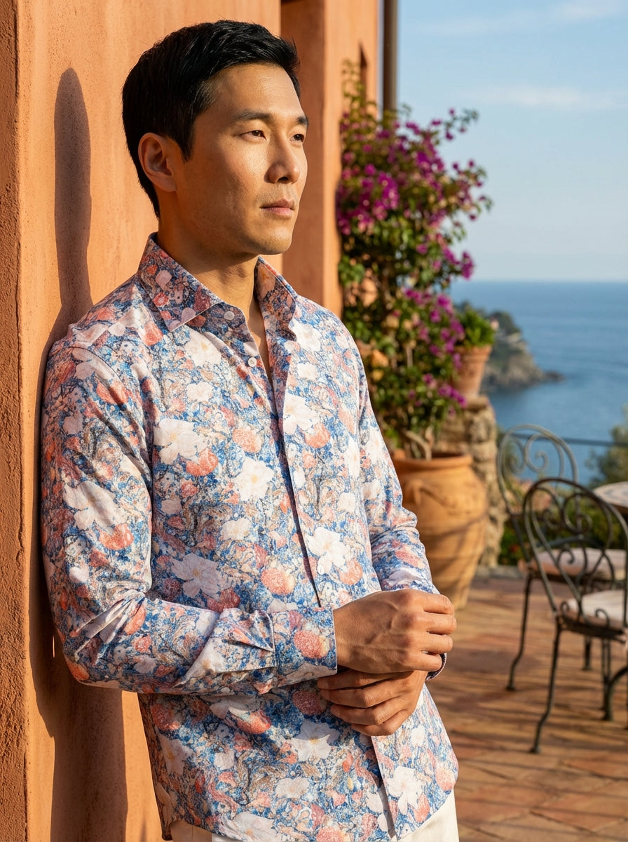Elevate your wardrobe with this Masutto long-sleeve button-down shirt. Featuring a vibrant, intricate floral and botanical print in shades of blue, coral, and white, this tailored garment offers a sophisticated yet artistic aesthetic perfect for modern, s