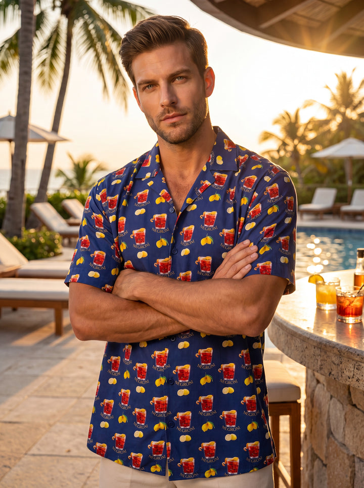This vibrant navy short-sleeve button-down shirt features a playful all-over Negroni cocktail and lemon print. Crafted from a lightweight, breathable fabric with a relaxed camp collar, it offers a stylish and casual fit perfect for warm-weather social gat